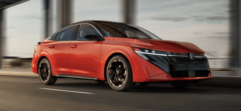 red 2026 nissan Sentra driving on road